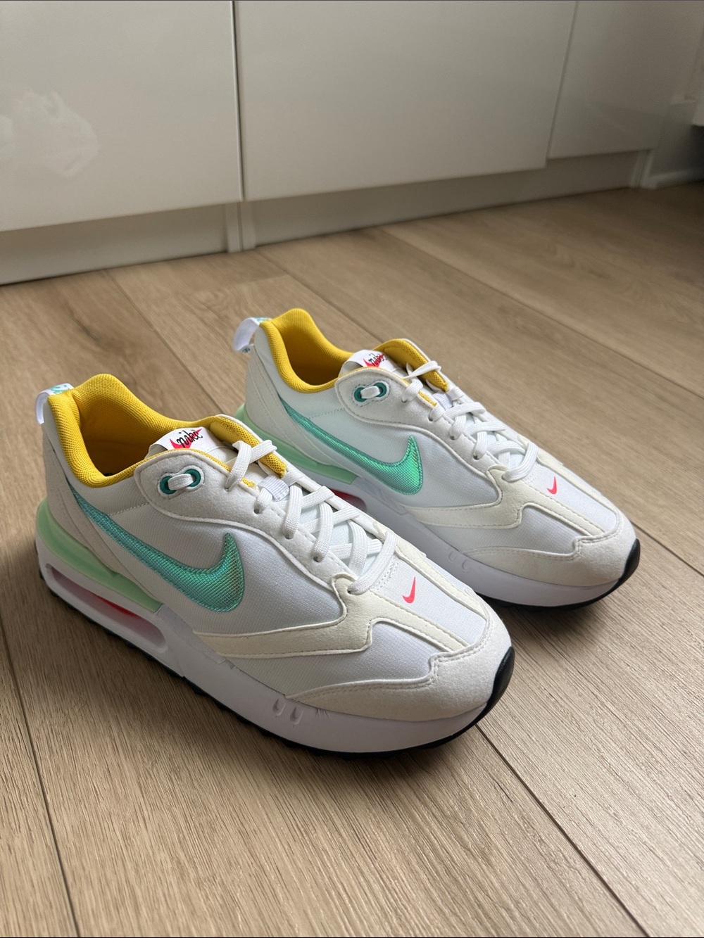 Nike Sneakers in White with Mint Swoosh and Yellow Lining